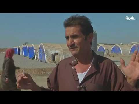 أم عراقية تبكي حرقة بعد خطف ابنها وقتله