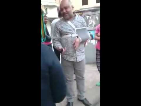 شاهد مندوب أحد المرشحين يهدد مواطنة